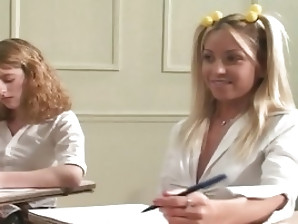 Two slutty schoolgirls in uniforms stay after class to please their teacher.