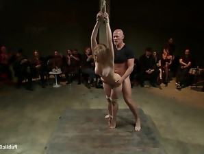 Blonde whore in a fetish BDSM fuck session fucking with her master in public.